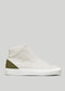 The V52 Off-White W/ Olive is a white mid-top sneaker with smooth leather, featuring an olive green heel panel and a white rubber sole, ethically handcrafted in Portugal for superior quality.