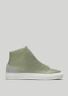 The V53 Pine W/ Plaster is a green high-top sneaker with a smooth finish and white sole, featuring light gray suede accents on the heel. Handcrafted in Portugal from premium Italian leathers, it offers both style and quality.