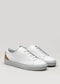 The V55 White Floater W/ Beige sneakers are masterfully handcrafted in Portugal using premium Italian leather, featuring white laces and tan heel accents, showcased on a plain light background.