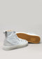 Une paire de chaussures en toile V12 Grey & Antique White sneakers, présentées à l'endroit et à l'envers sur un fond neutre pour montrer les détails du dessus et de la semelle, parfaites comme chaussures personnalisées.