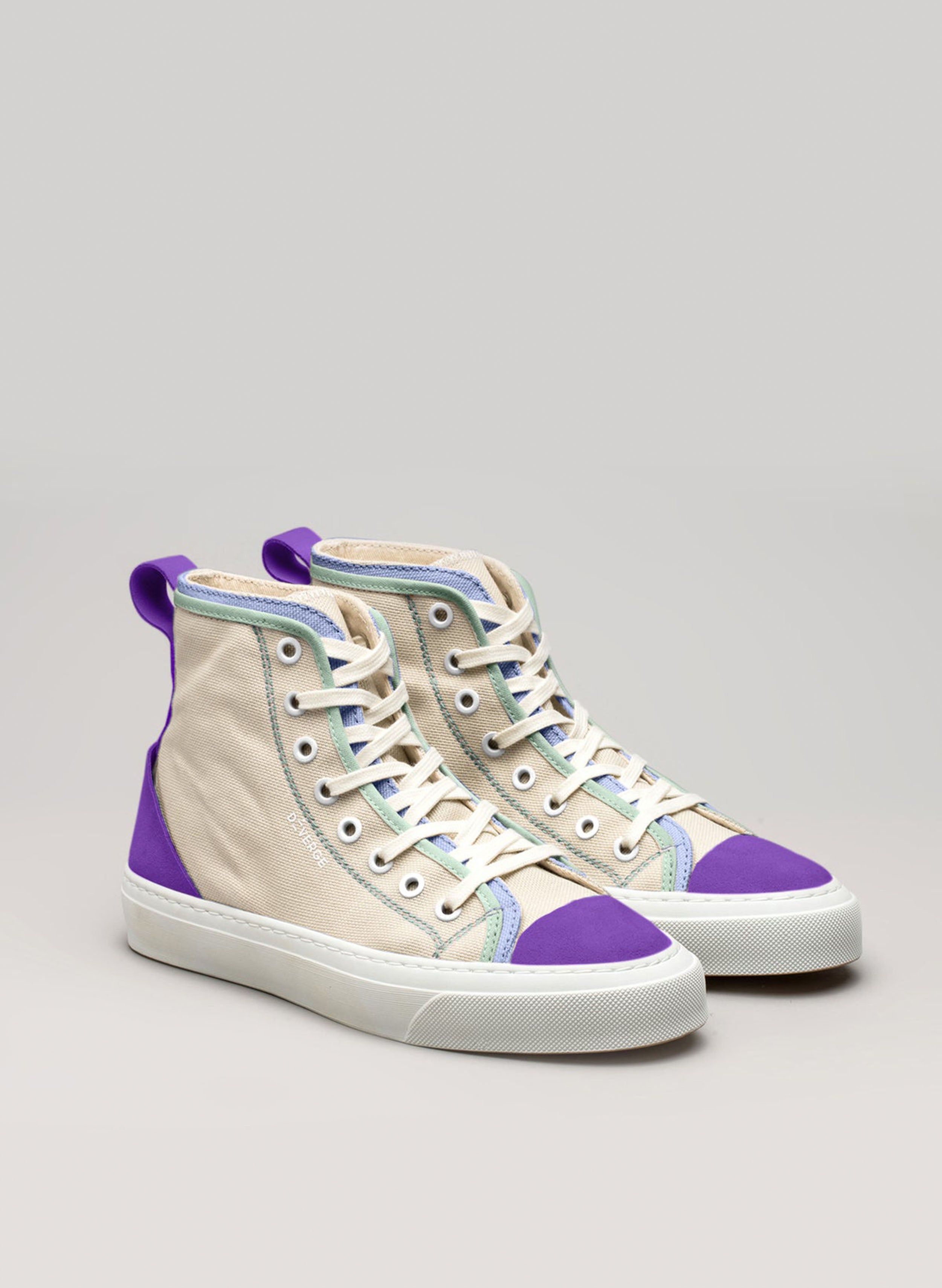 A pair of custom high top sneakers from Diverge promoting social impact throught the imagine project.