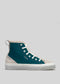 Sneaker alta in pelle scamosciata DiVERGE X BUREL  Aqua & Teal con pannelli beige, lacci bianchi e una spessa suola bianca su sfondo grigio chiaro.