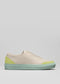 Side view of a V16 Beige W/ Lime leather slip-on sneaker with a pale beige upper and a contrasting light green toe and sole.