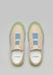 Un paio di scarpe slip-on V16 Beige W/ Lime con accenti blu e verdi, su sfondo grigio.