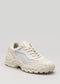 A single V10 Leather Color Mix Beige chunky low-top sneaker with thick soles displayed against a light gray background.