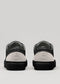 negro con gris cuero premium bajo par de sneakers en diseño limpio backview