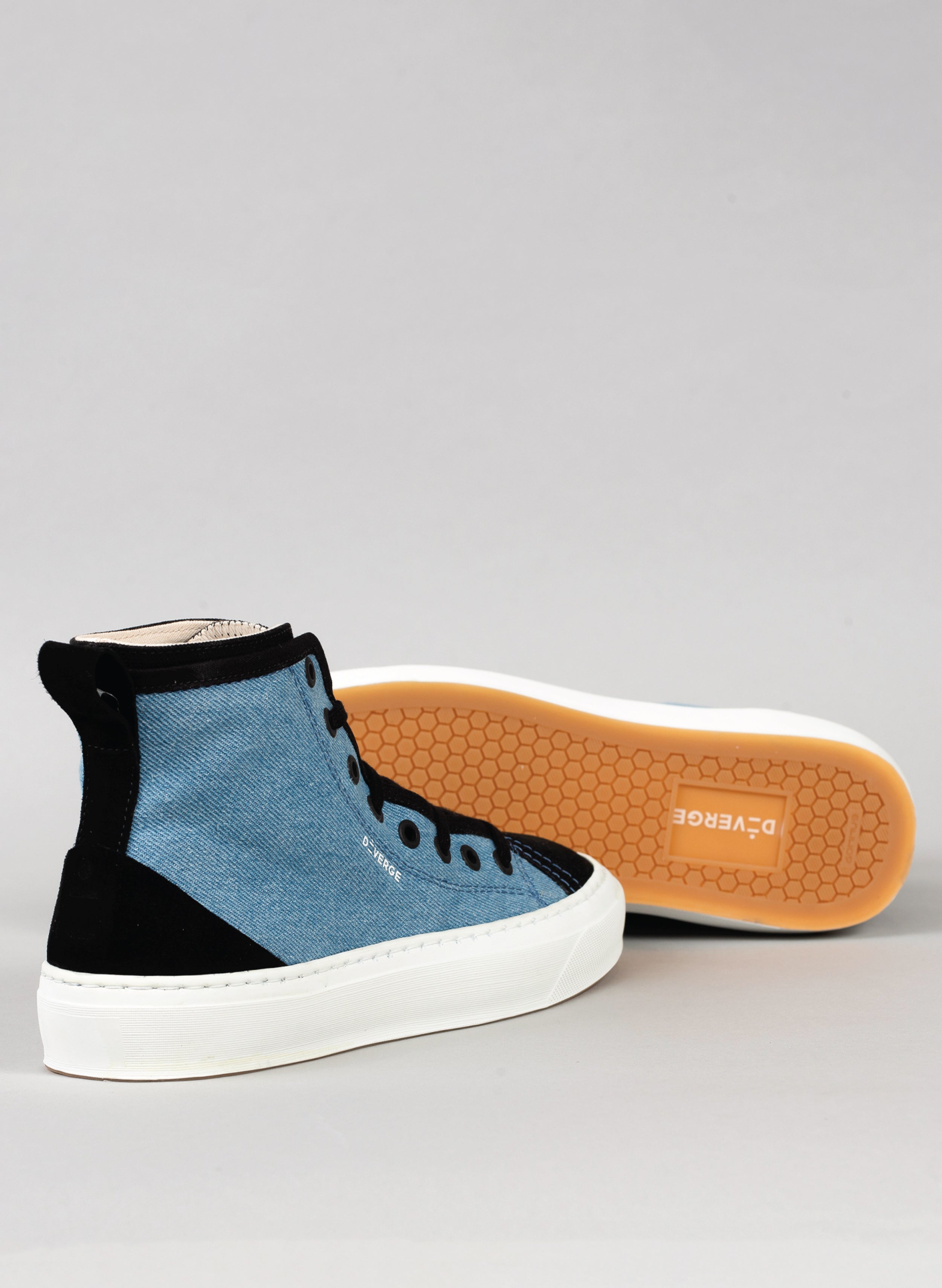 Black and denim high top sneakers with white sole by Diverge, promoting social impact and custom shoes.