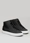 Paire de chaussures montantes MH0003 by Chrys  sneakers  avec lacets noirs et semelles blanches, présentées sur un fond gris clair.