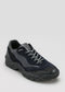 black premium leather sneakers landscape with sophisticated silhouette frontview