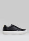 A single V14 Vegan Black sneaker with white soles displayed against a plain grey background.