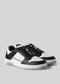 black and white futuristic with retro flair low sneaker frontview