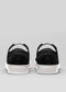 black with white premium leather slip-on sneakers with straps in clean design backview