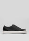 A SO0004 Backwite slip-on sneaker with white soles, photographed on a gray background.