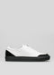 black with white premium leather slip-on sneakers with straps in clean design sideview