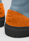 Close-up of MH0013 Seychelles Sun with orange suede details and thick black rubber soles, displaying an embossed logo on the heel.