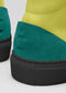 Primer plano de una zapatilla alta de cuero MH00019 diVERGE Colors con atrevida suela negra, que muestra las texturas y los vibrantes colores.