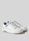 A pair of V5 White W/Blue leather sneakers on a gray background.