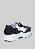 color mix black and white premium leather sneakers landscape with sophisticated silhouette backview