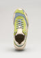 A V20 Leather Color Mix Lime low top sneaker facing forward, featuring shades of beige, green, and blue with white laces.