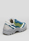 A side view of a V16 Leather Color Mix Pine sneaker with white, blue, and green color panels and a sculpted white sole.