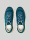 A pair of DIVERGE X BUREL Teal suede sneakers with white laces, viewed from above.