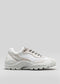 V6 Leather Color Mix White low-top sneaker with chunky sole and lace-up front, displayed against a light gray background.