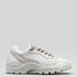 V6 Leather Color Mix White low-top sneaker with chunky sole and lace-up front, displayed against a light gray background.