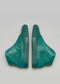 A pair of V2 Emerald Green Floater displayed against a light gray background.