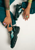 girl wearing black tie dye aqua green premium canvas sneakers landscape with sophisticated silhouette