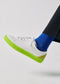 A person wearing ML0080 White Floater W/ Grey with light blue jeans with frayed edges and text along the side seam, featuring ethically made to order designs.