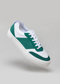 green and white premium leather sneakers in contemporary design floating sideview