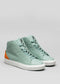 A pair of high-top custom V38 Green W/ White shoes with orange heel patches and white soles, displayed on a light grey background.