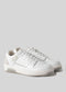 Un paio di scarpe Start with a White Canvas low top sneakers con un design semplice e lacci frontali, visualizzati su uno sfondo grigio chiaro.