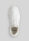 Vista dall'alto di una singola sneaker low-top V7 Grey W/ Off-White su uno sfondo semplice, caratterizzata da un design pulito con lacci e perforazioni sulla punta.
