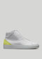 White leather high-top sneaker with a neon yellow heel accent on a plain background from the MH0005 Be Your Own Star collection.