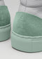 Close-up of the back heels of two V35 Grey W/ Pastel Green high top sneakers with a textured design and embossed logo.