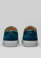 Rear view of V15 Ocean Blue Leather W/ Grey low top sneakers with white soles against a neutral gray background.
