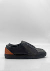 The ML0134 Deep Blue Floater W/ Caramel sneakers are crafted from premium Italian leathers, featuring a deep blue low-top design with a caramel heel accent on a plain white background. Handcrafted in Portugal for superior quality and style.