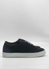 The ML0133 Black Suede sneakers, handcrafted in Portugal, feature white rubber soles and are elegantly showcased from the side against a plain white background.