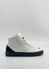 The MH0158 White W/ Black, a handcrafted high-top sneaker from Portugal, features black accents, a sleek design, and flat sole. Ethically made to order, it's elegantly displayed on a white background.