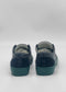 The ML0141 Black W/ Green sneakers have green soles and are handcrafted in Portugal, shown from the back against a white background.