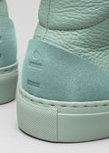 pastel green premium leather high sneakers in clean design close-up materials