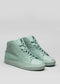 A pair of V24 Pastel Green Floater leather high-top sneakers against a white background.