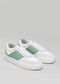 A pair of V22 Pastel Green & Lime leather sneakers on a gray background.