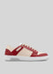 The M0024 by Rodrigo is a handcrafted low-top sneaker made in Portugal with premium Italian leathers, featuring perforated details, beige laces, and a white sole against a plain gray background.