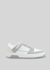A single M0004 by Sara A low top sneaker with purple laces on a light gray background.