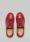Un paio di V3 Red Wine Leather low top sneakers visualizzate su uno sfondo grigio, viste dall'alto.