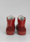 Pair of MH0053 Red w/ Scarlet leather shoes with a rounded toe and low heel, displayed against a neutral gray background.