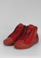 A pair of MH0053 Red w/ Scarlet leather high-top sneakers positioned upright on a gray background.