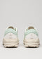 Rear view of two V7 Full Color Sage Green custom shoes with chunky white soles on a light gray background.